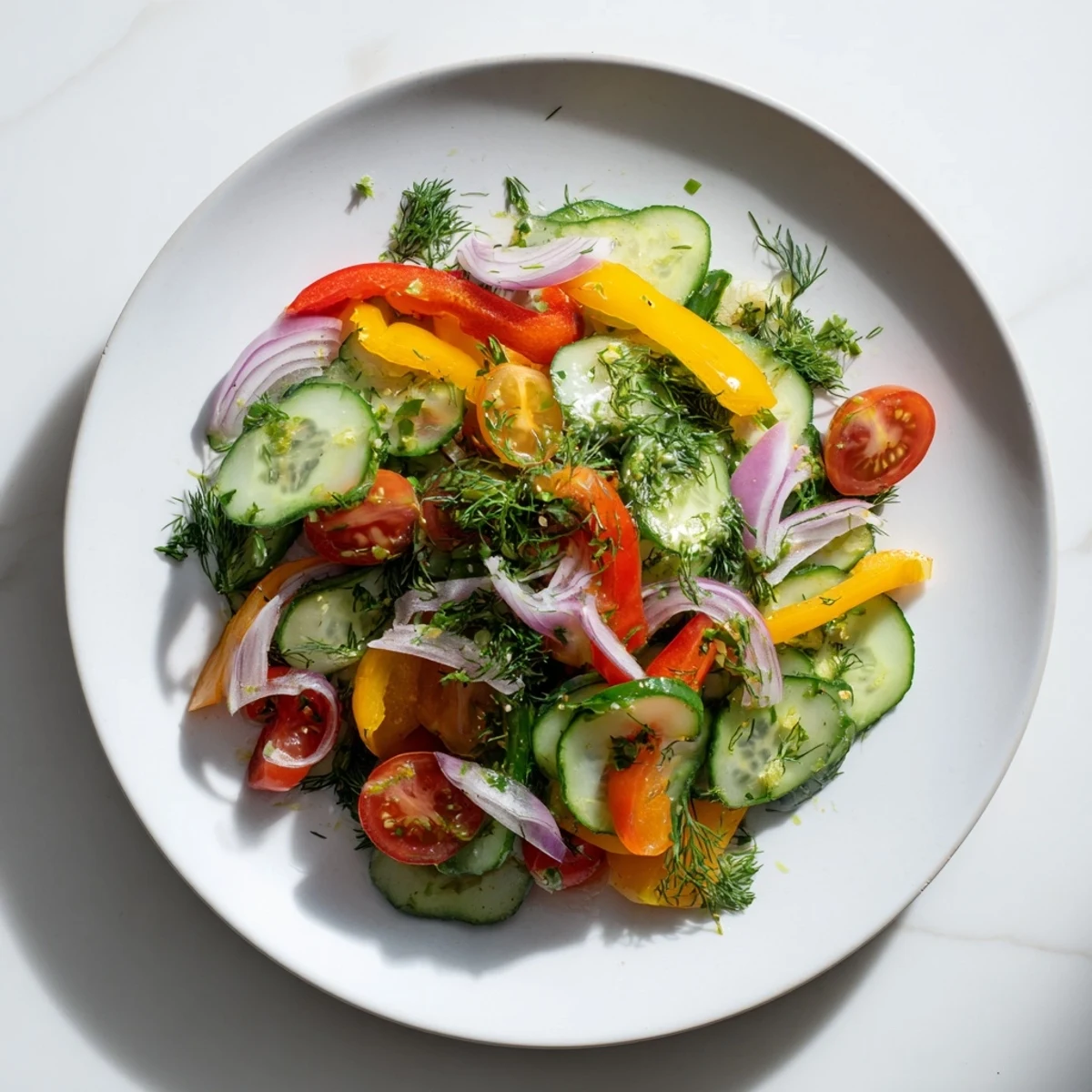 Vibrant cucumber and sweet pepper salad featuring crisp red peppers and cherry tomatoes