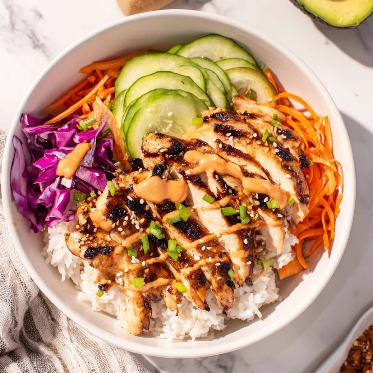 Korean BBQ chicken bowls featuring glazed grilled chicken over fluffy rice with colorful fresh vegetables and spicy gochujang mayo drizzle