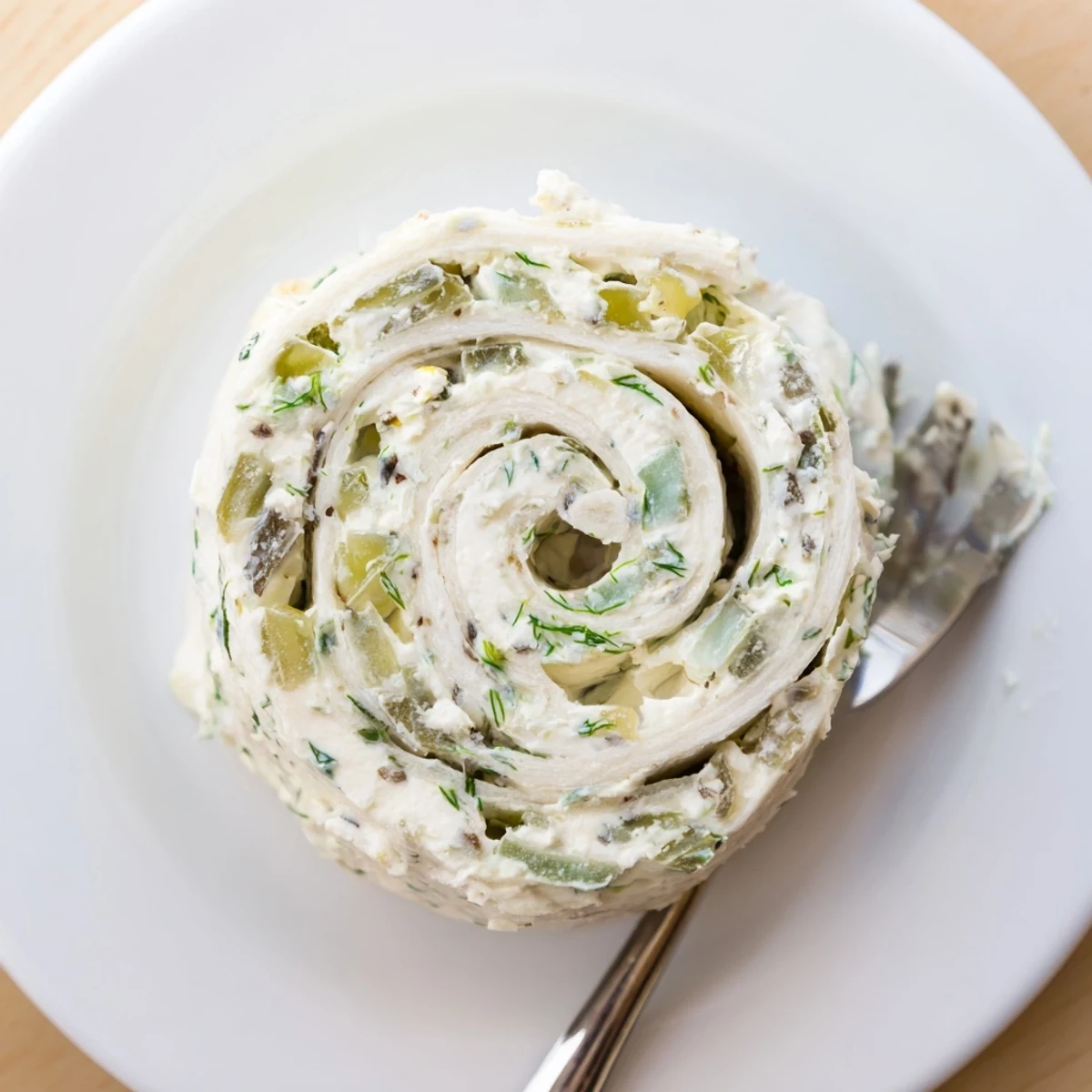 Pickle Dip Pinwheels piled high, chilled appetizer with green onion flecks