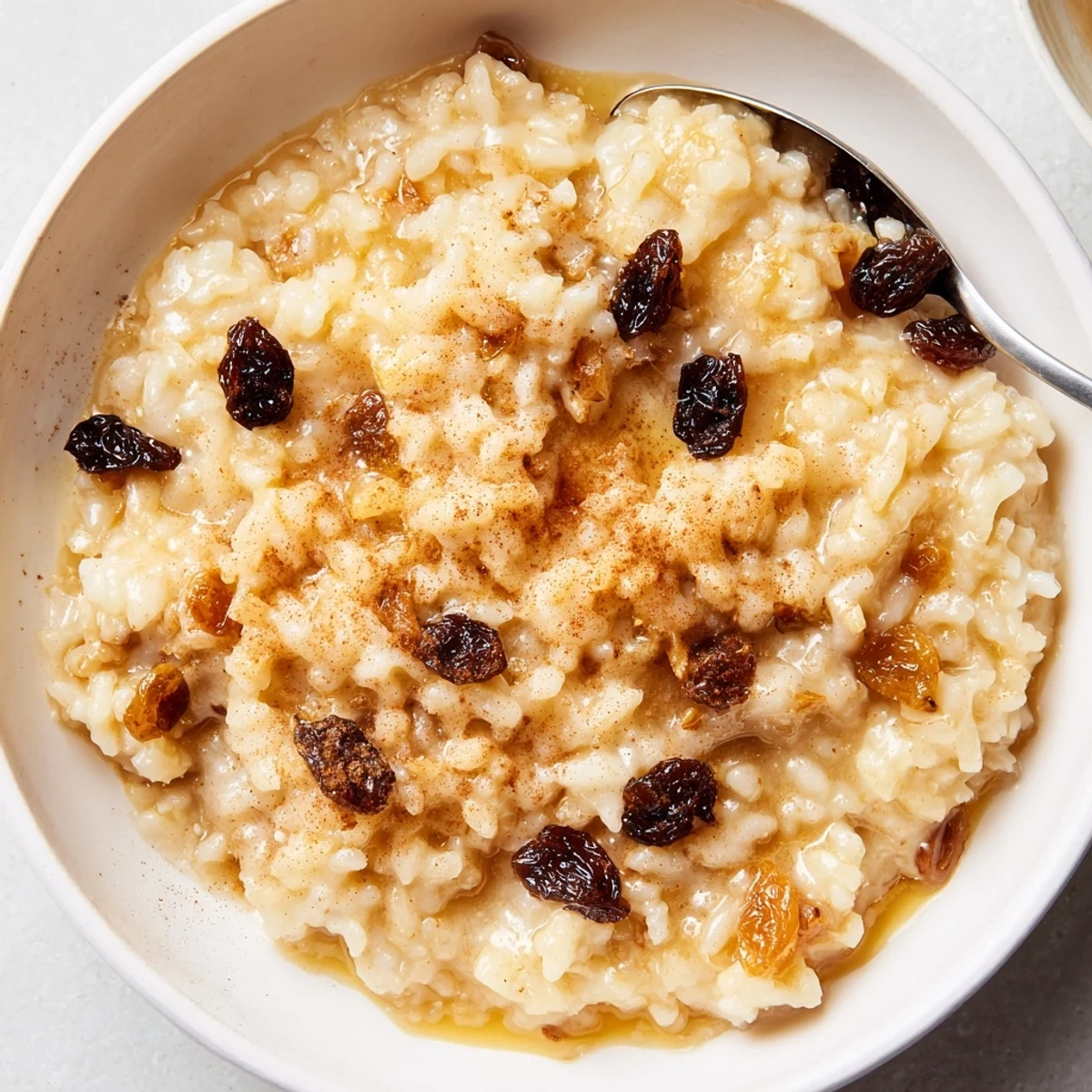 Chilled glass bowl of Delicious Condensed Milk Baked Rice Pudding Recipe To Try