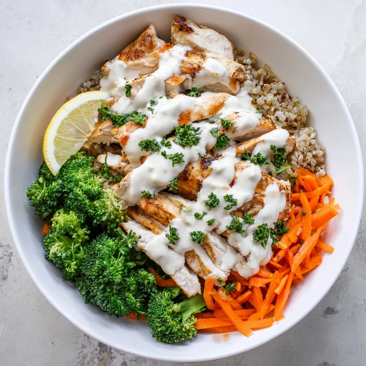 Close-up of nourishing grain bowl featuring juicy spiced chicken fresh broccoli and velvety garlic sauce topping