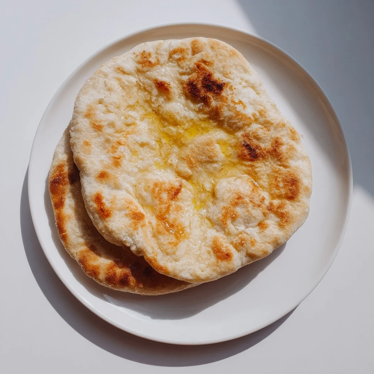 Homemade Turkish Bazlama flatbread with slightly chewy crust perfect for dipping or wrapping