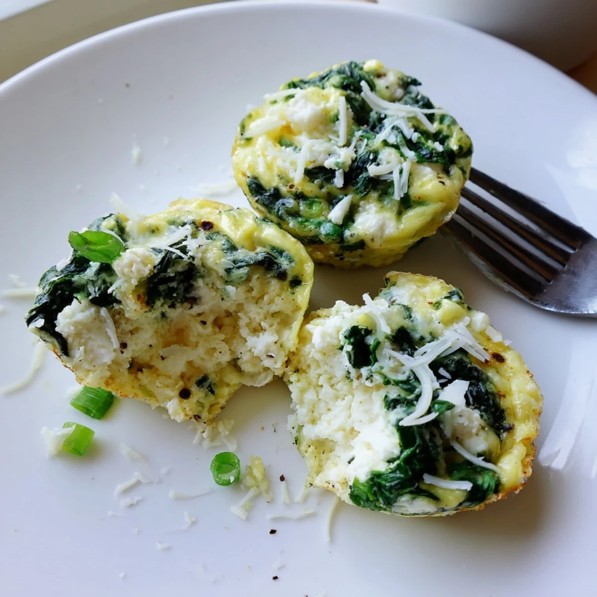 Savory Spinach Feta Egg Bites with golden tops, moist centers, tangy finish.