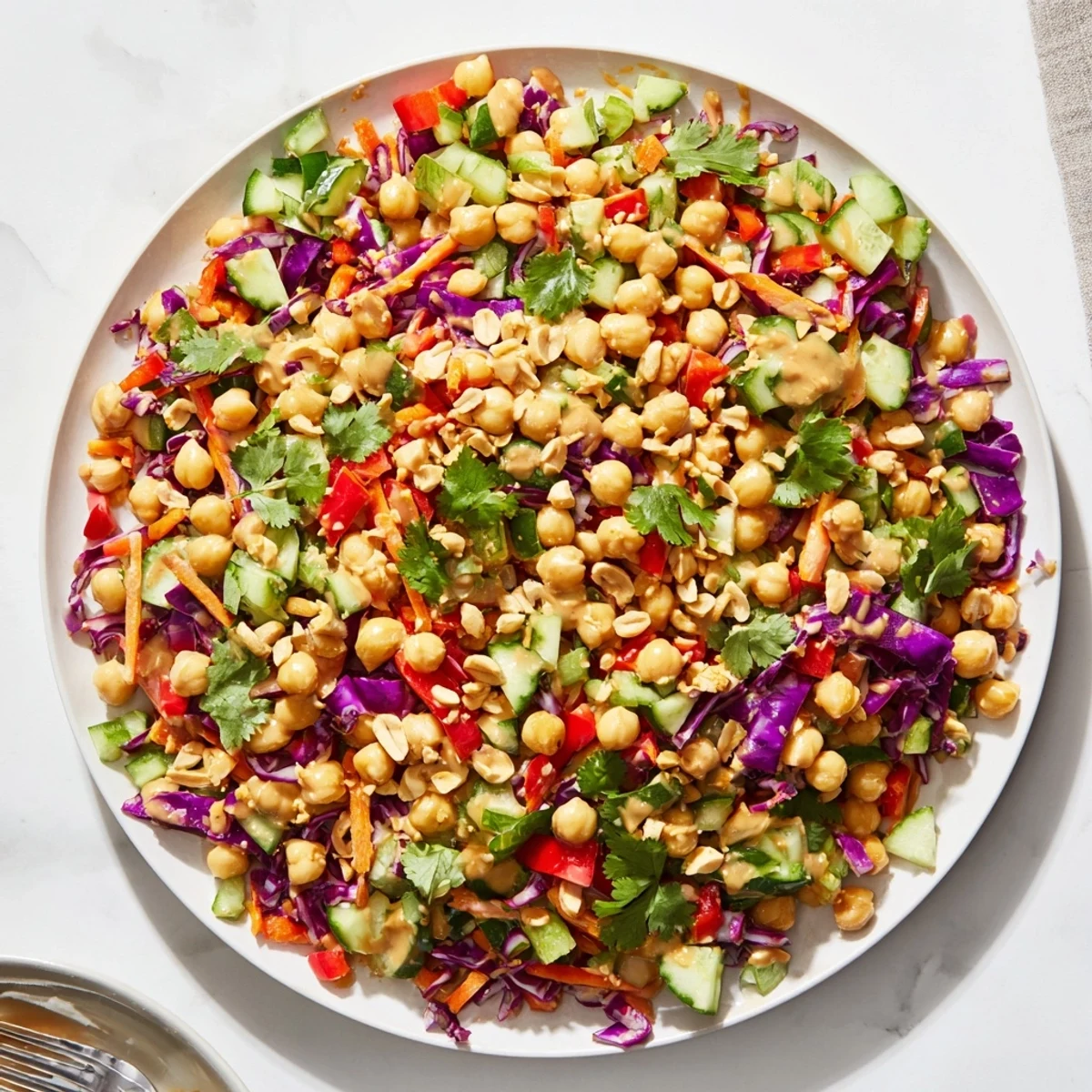Crunchy Thai Chickpea Salad loaded with shredded cabbage carrots and zesty peanut dressing